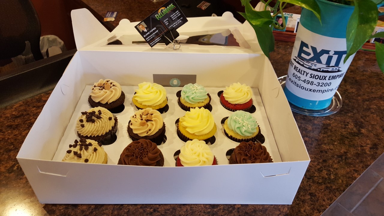 EXIT Realty Sioux Empire thanks Reliabank for Cupcakes